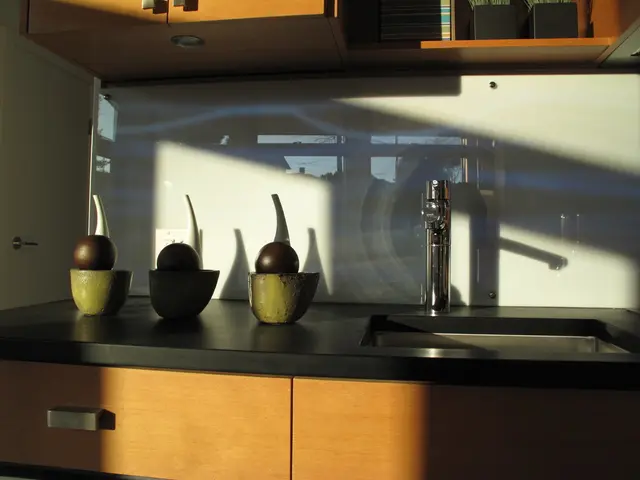 A rustic wooden kitchen showcases the popularity of Delft tiles as a contemporary design choice....