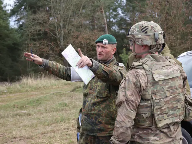 In the picture there are two officers standing in front of a vehicle and beside them there are many...