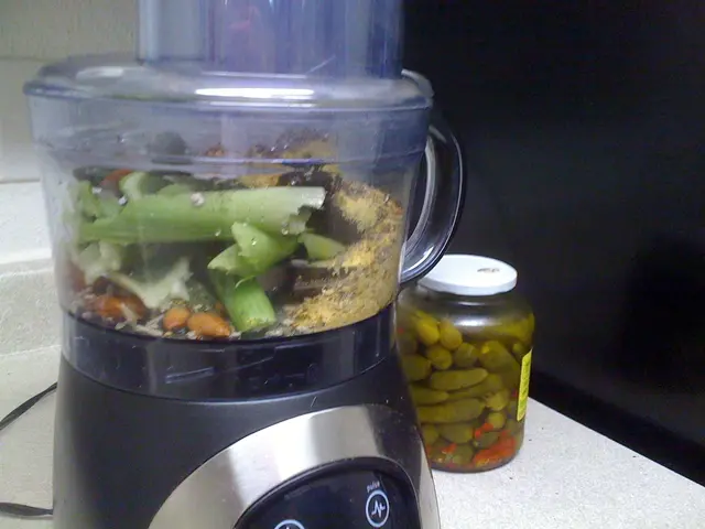 The picture consists of a mixer, jar and cable on a white surface.