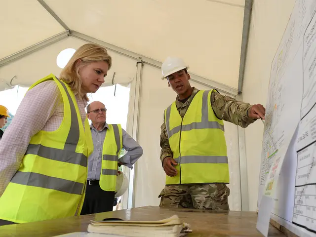 This picture describes about group of people, few people wore helmets, in front of them we can see...